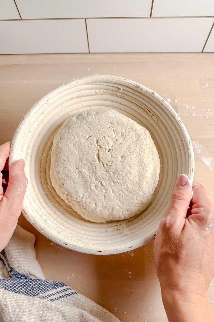 put dough into banneton basket upside down