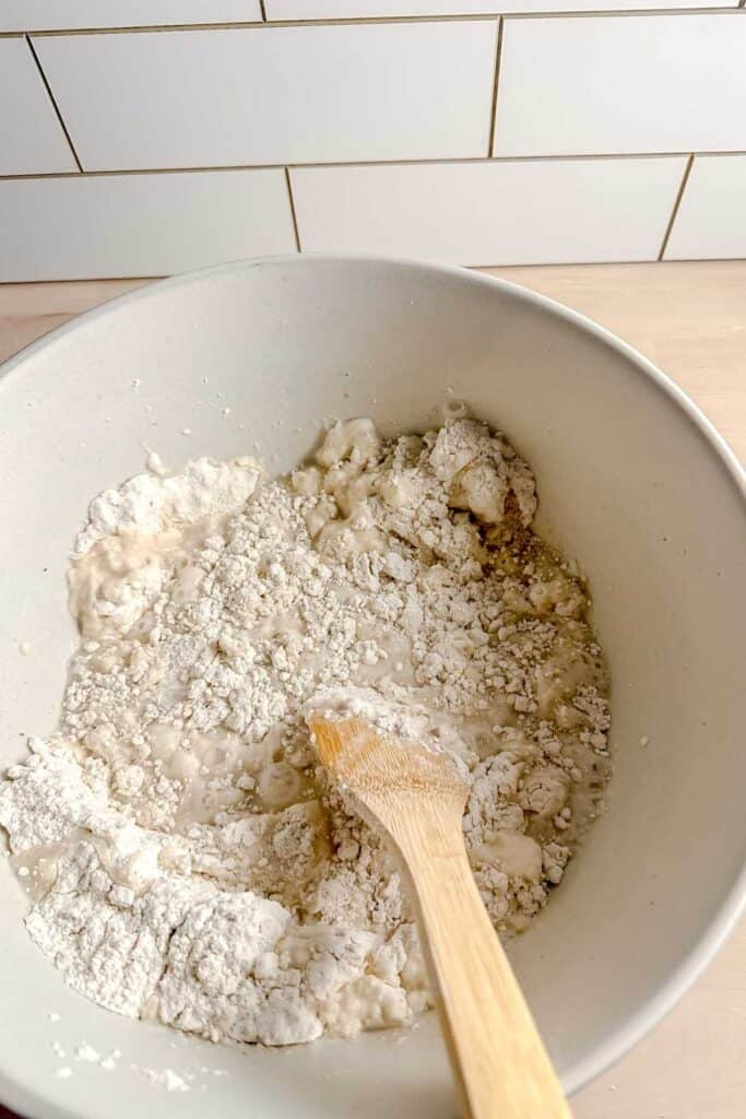 wet ingredients being added to the dry ingredients