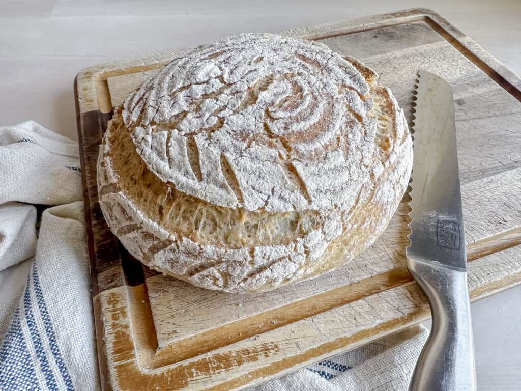 loaf of gluten free sourdough bread on cutting board