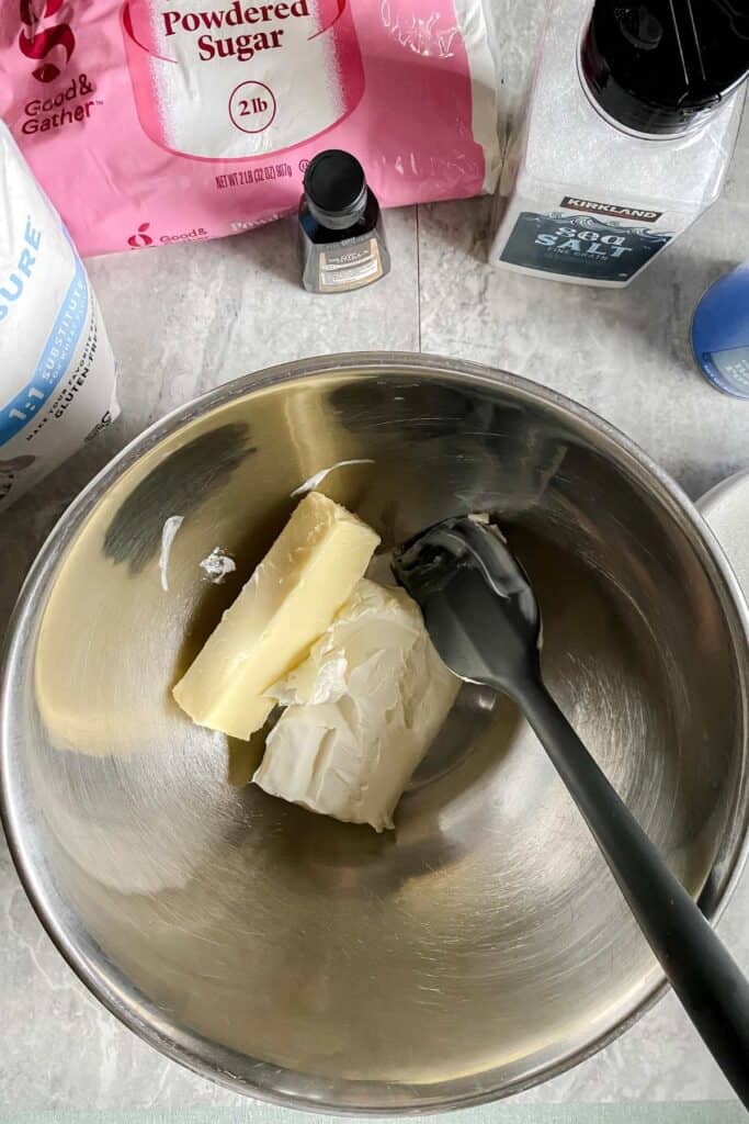 stick of butter and cream cheese in bowl