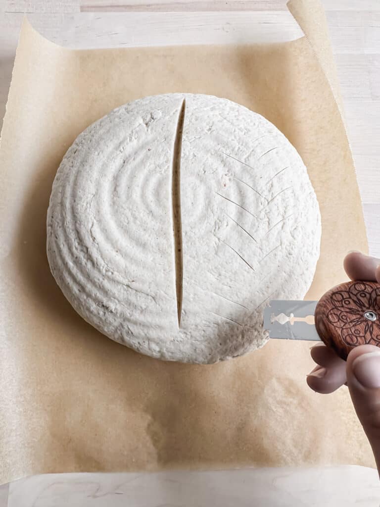scoring a pattern on the gluten free artisan bread loaf