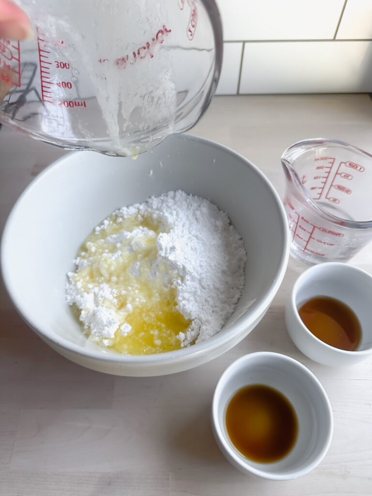 ingredients for maple vanilla frosting in little white bowls
