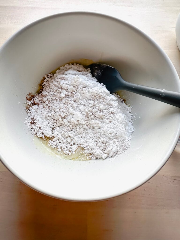 add the dry ingredients into the wet for the frosting