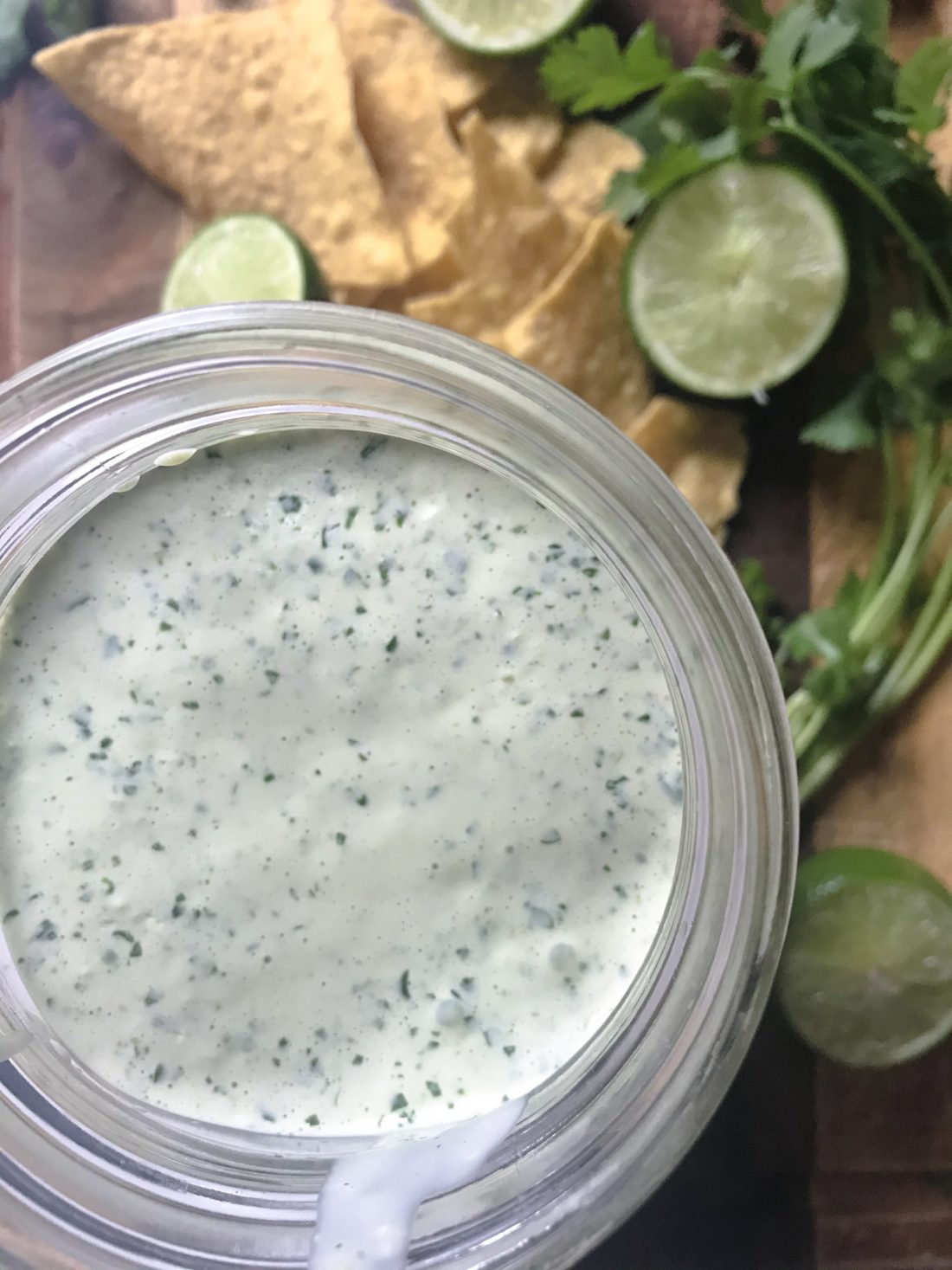 cilantro lime sauce close up with limes