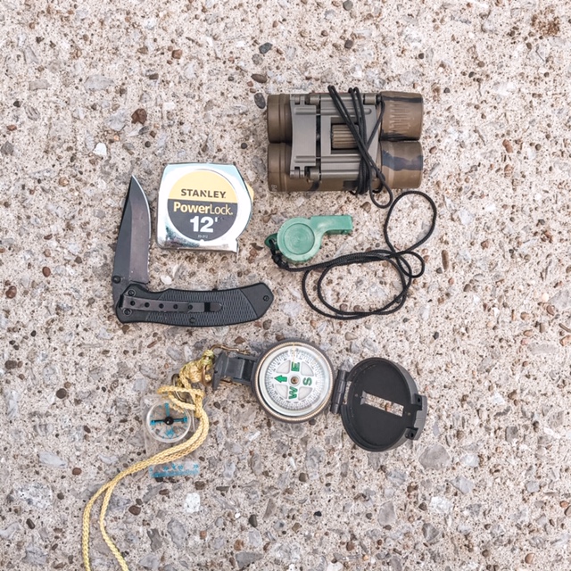nature journaling supplies pocket knife, whistle, tape measure, binoculars, compass