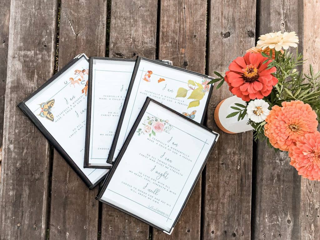 morning time menus laid on picnic table with flowers 