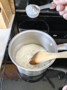 gluten free flour being added to melted butter