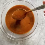 bowl of homemade gluten free enchilada sauce red
