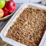 gluten free apple crisp with oats in a white 9x13 pan