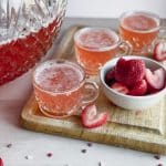 cups of party punch with strawberries