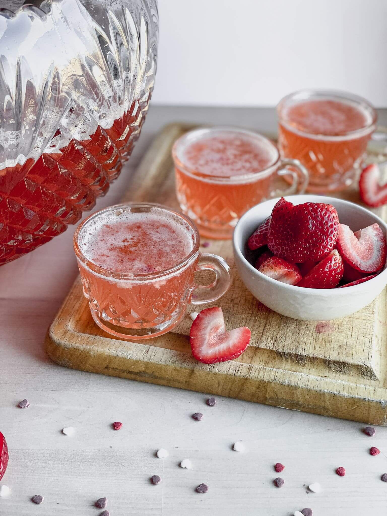 cups of party punch with strawberries