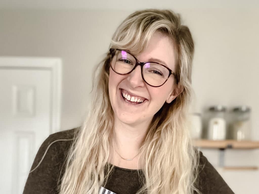 woman with blonde hair wears striped apron