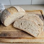 gluten free artisan loaf sliced on cutting board