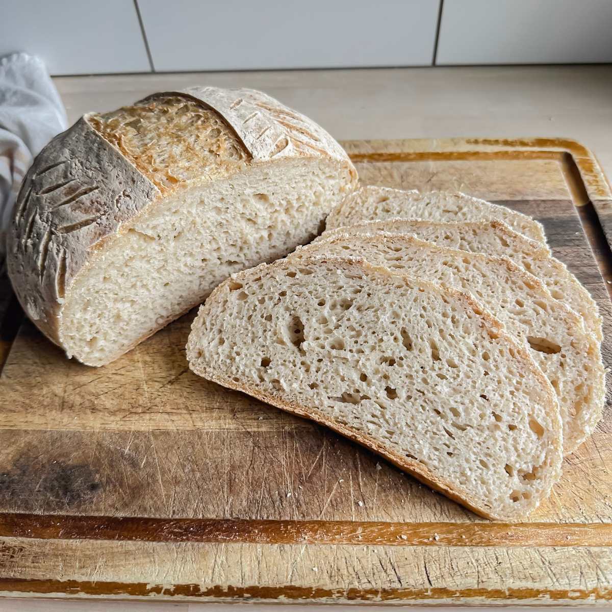 gluten free artisan loaf sliced on cutting board