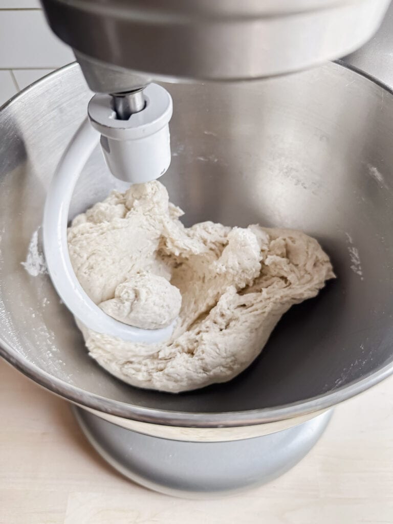 gluten free sourdough dough mixing in a kitchen aid stand mixer