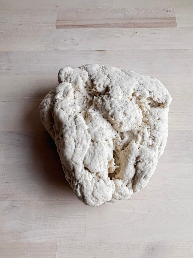 lump of gluten free sourdough bread dough on countertop