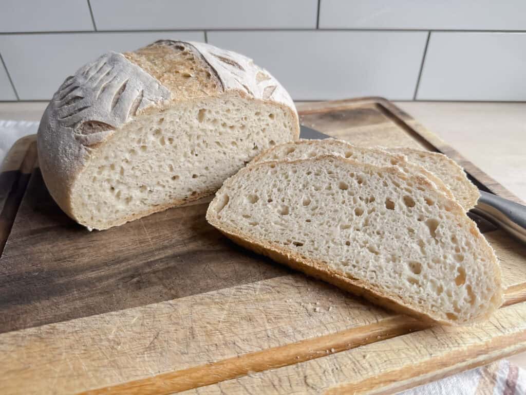 homemade gluten free sourdough artisan loaf on cutting board