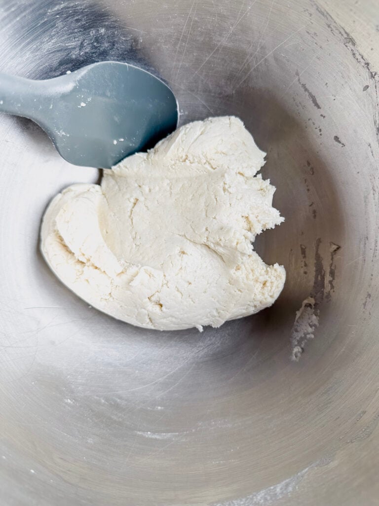 bowl with formed tortilla dough and a spatula