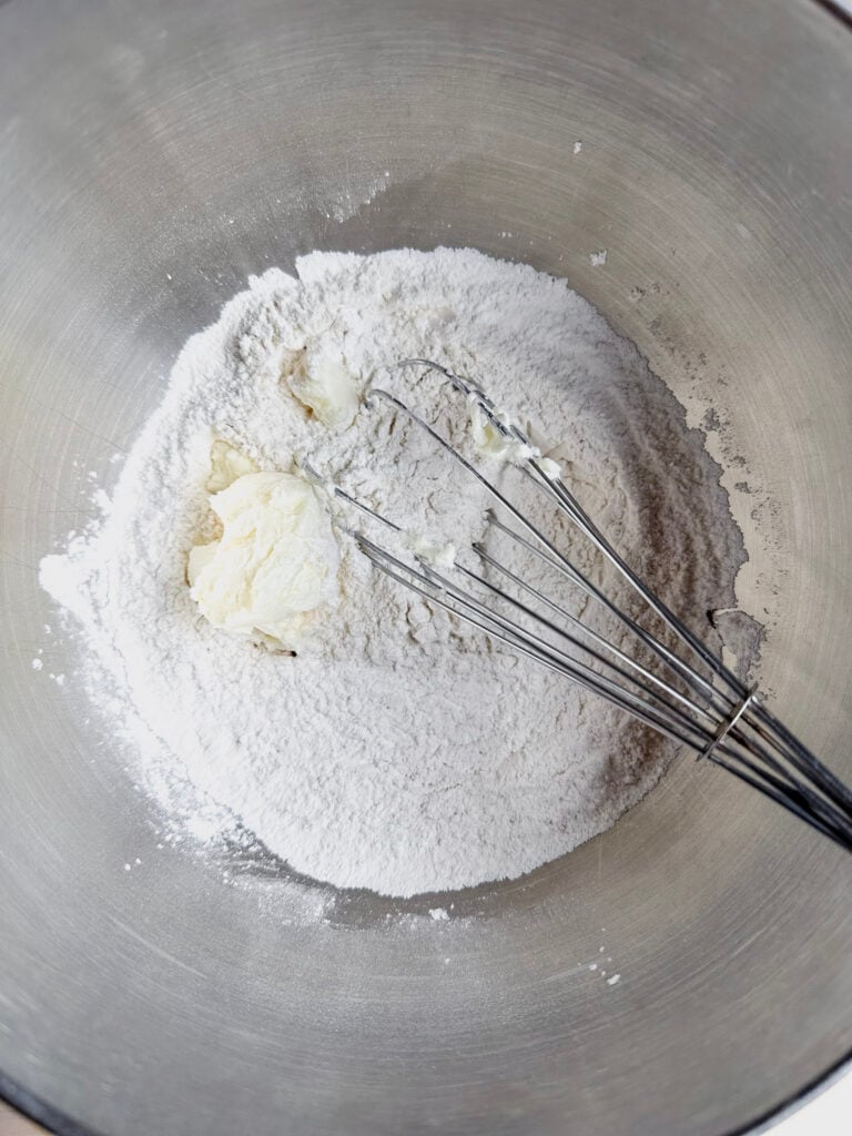 large mixing bowl with palm shortening and wire whisk
