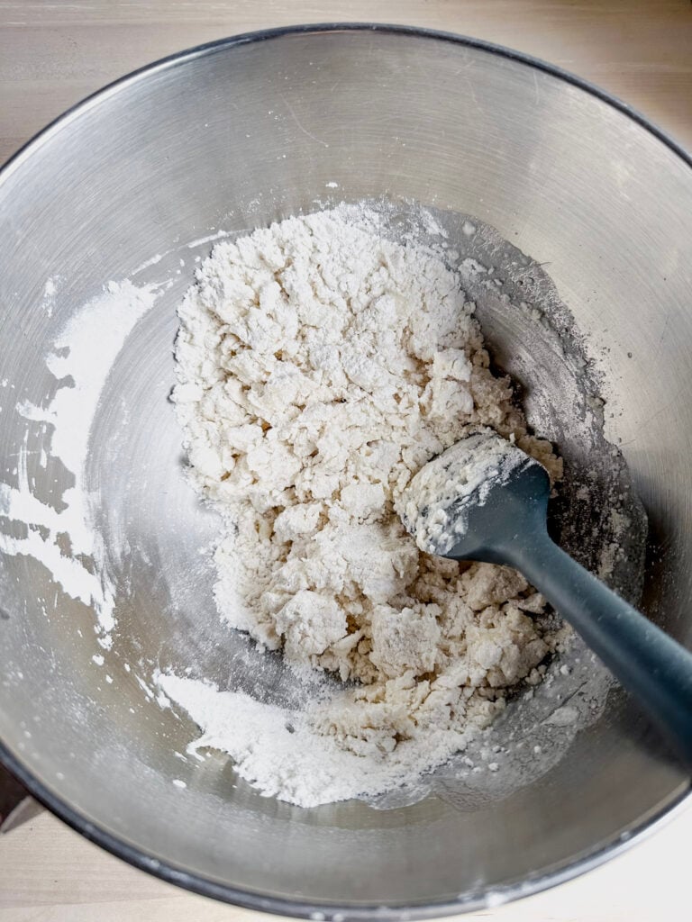 roughly mixed gf tortilla dough in mixing bowl