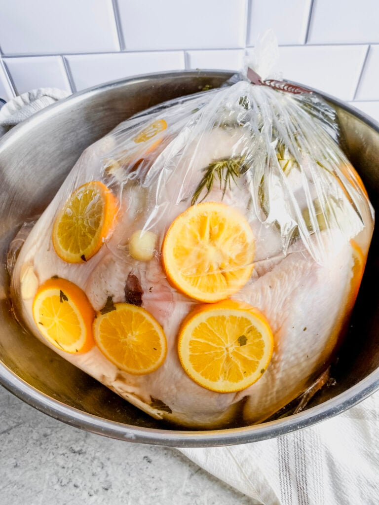 whole thawed turkey in a brining bag with brine solution