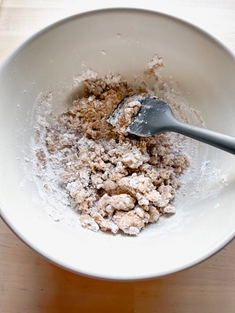 stirring together the melted butter and powdered sugar