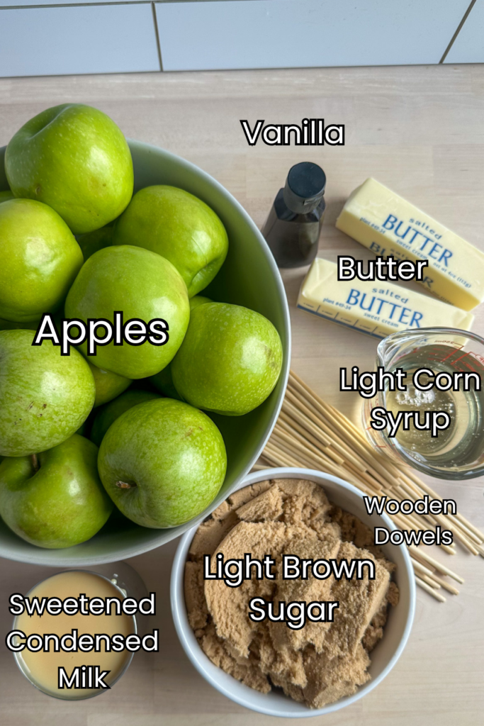 ingredients for caramel apples on a stick on a counter. green apples, brown sugar, and others