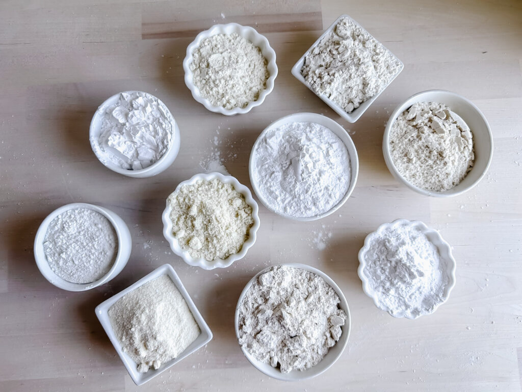 small bowls filled with different kinds of gluten free flours 