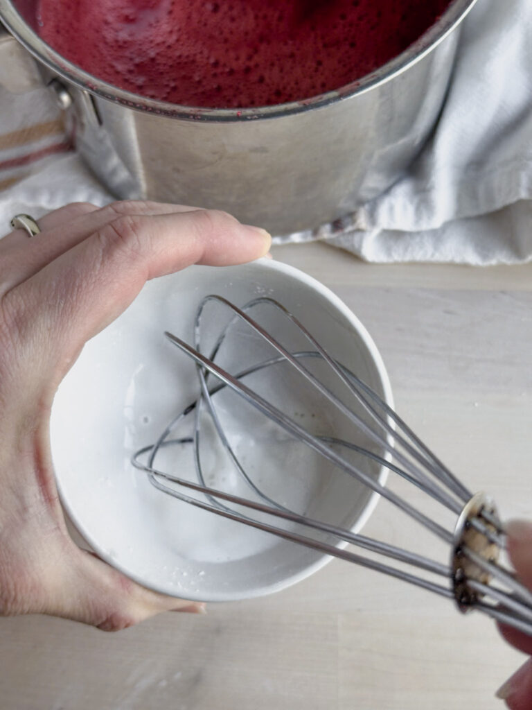 whisking cornstarch and water for a slurry