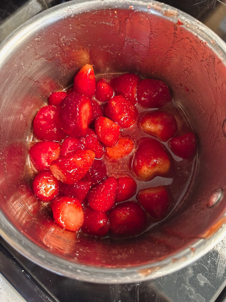 strawberries in saucepan releasing their juices