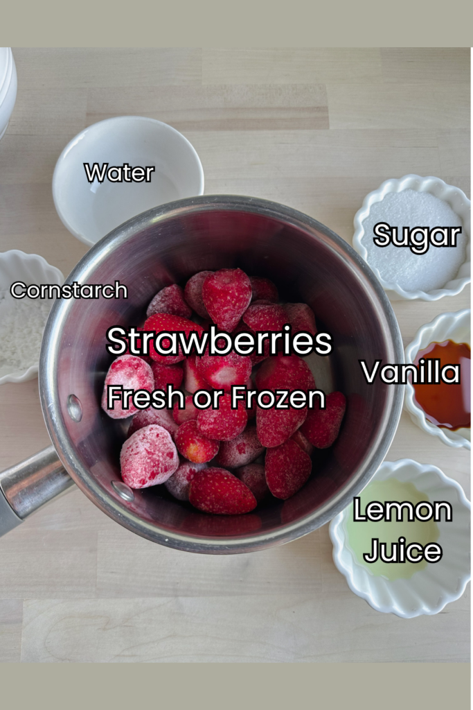 a medium sauce pan with frozen strawberries and small white bowls with ingredients in them. 