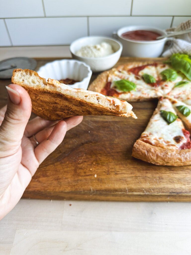 showing the bottom crips texture of the gluten free pizza crust 